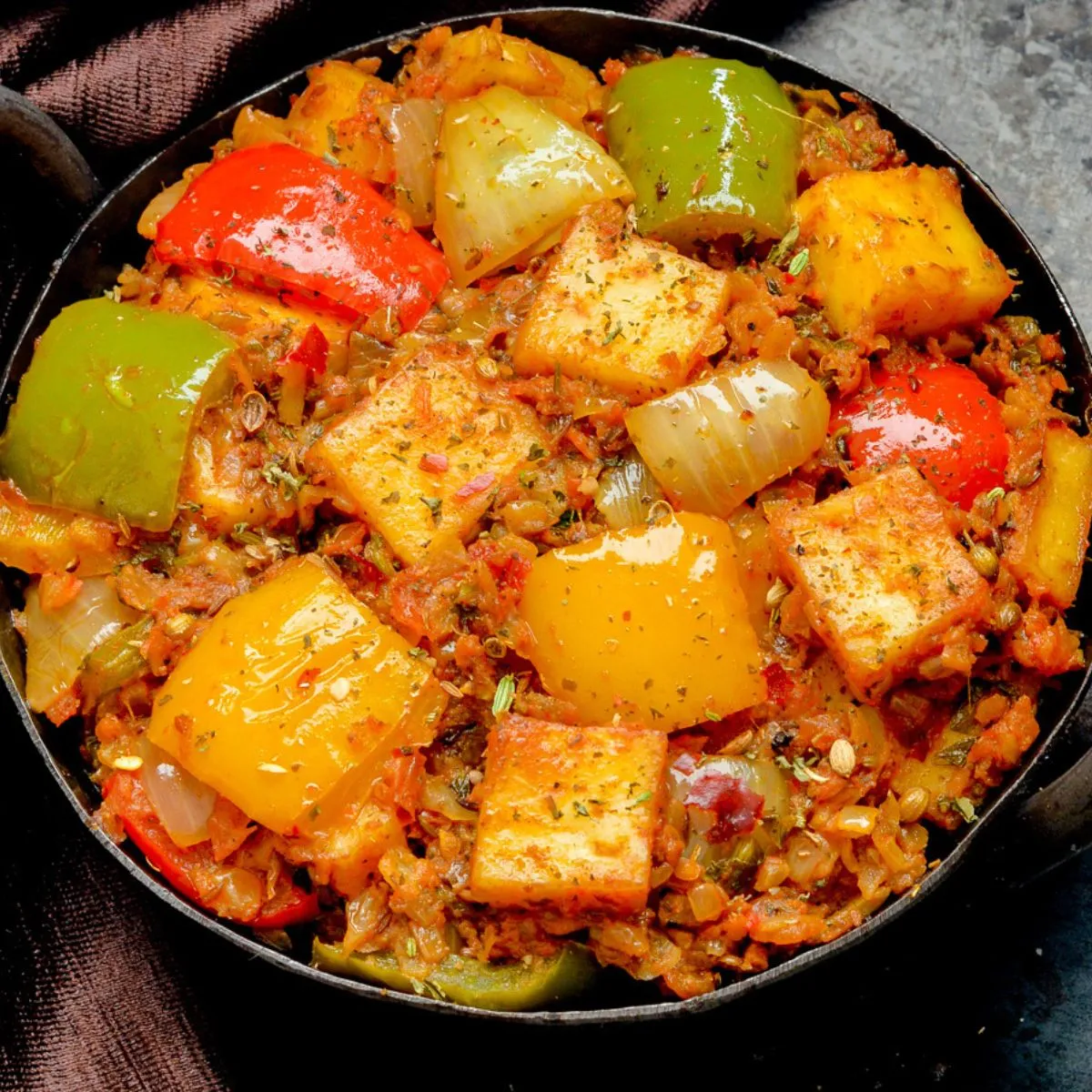 Signature Indian dishes at New Mountain Village Edmonton - Butter Chicken, Momos, Goat Biryani, and Paneer specialties